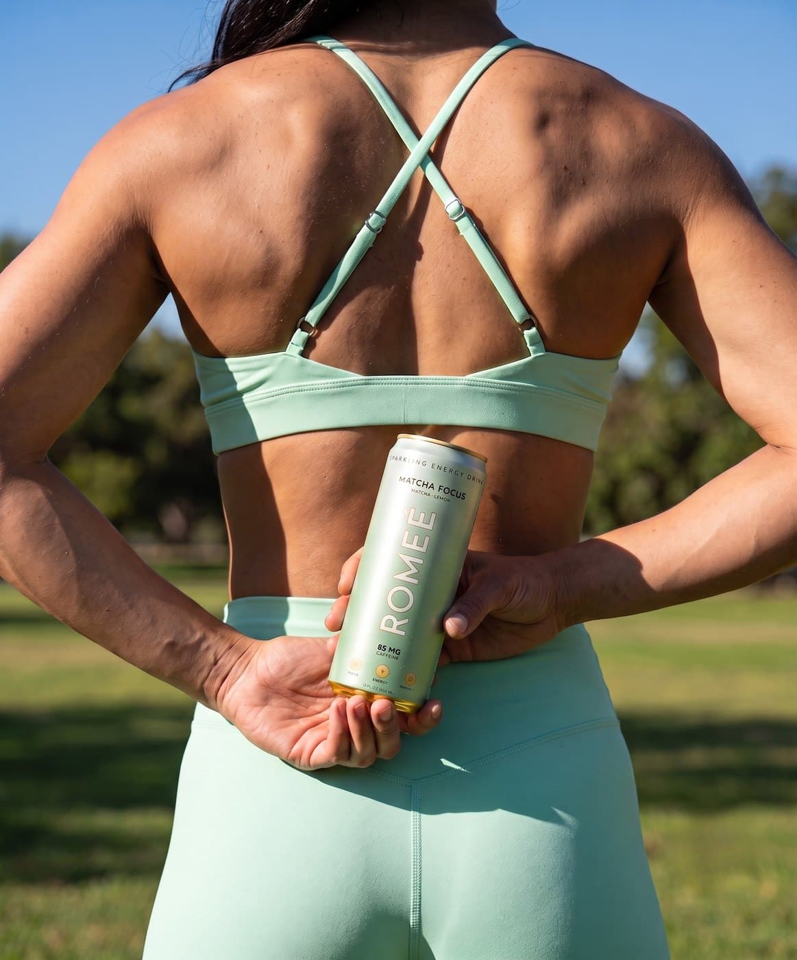 Matcha Focus held behind the back after a workout